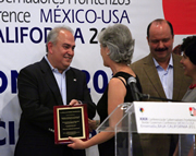 Laura Silvan receiving an award by the Governor of Baja California